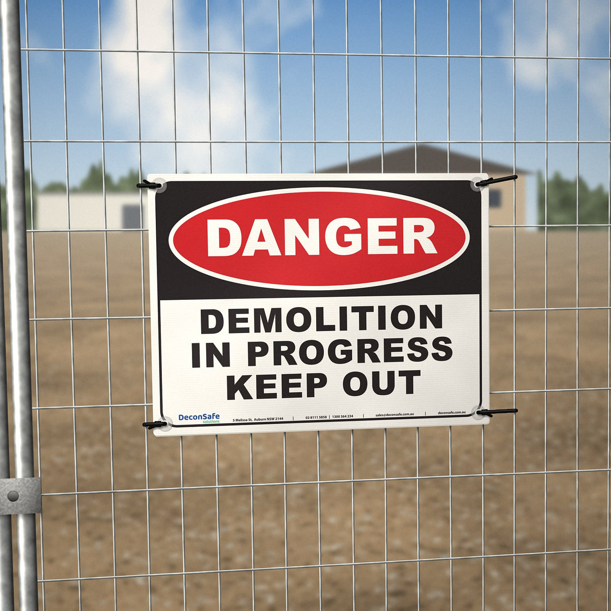 Danger Demolition In Progress Keep Out sign cable-tied to a temporary site fence