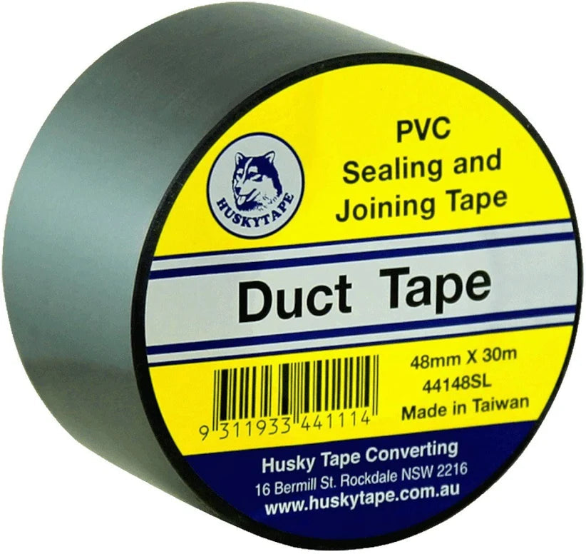 A roll of Husky Tape Duct Tape, 48mm x 30m, designed for sealing and joining ducts. The product is shown at a three-quarter angle, revealing the dark gray-green PVC tape on the side while displaying its bright yellow, blue, and white label.