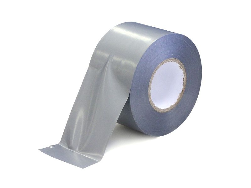 A roll of grey duct tape partially unrolled on a white background, featuring a smooth, semi-gloss finish and a plain white inner core.