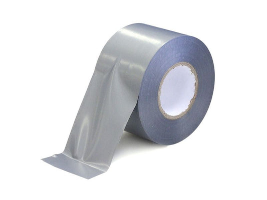 A roll of grey duct tape partially unrolled on a white background, featuring a smooth, semi-gloss finish and a plain white inner core.