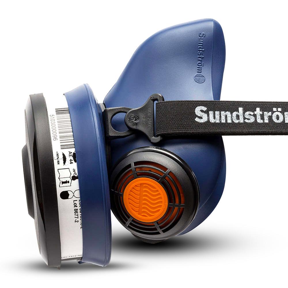 Side profile of a blue Sundström half-mask respirator with a filter and an orange valve.