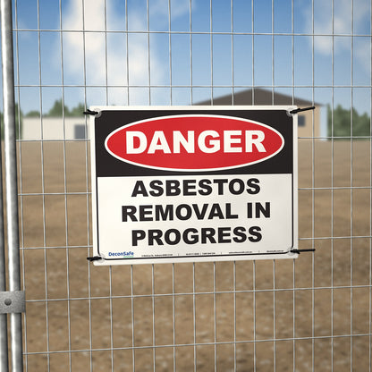 Danger Asbestos Removal In Progress sign cable-tied to a temporary site fence