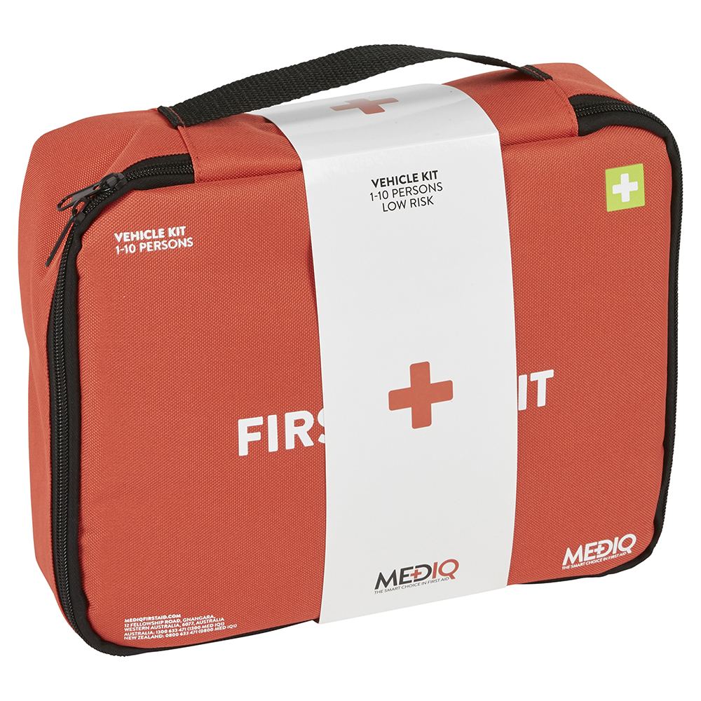 An orange-red vehicle first aid kit pouch with a white wrap label, black zipper, and black handle, photographed on a clean white background.