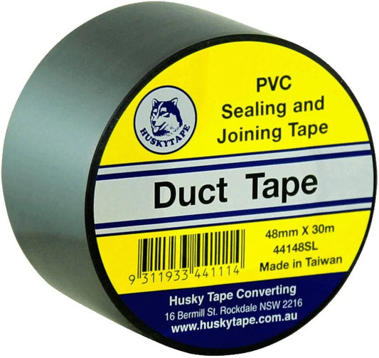 A roll of Husky Tape Duct Tape, 48mm x 30m, designed for sealing and joining ducts. The product is shown at a three-quarter angle, revealing the dark gray-green PVC tape on the side while displaying its bright yellow, blue, and white label.