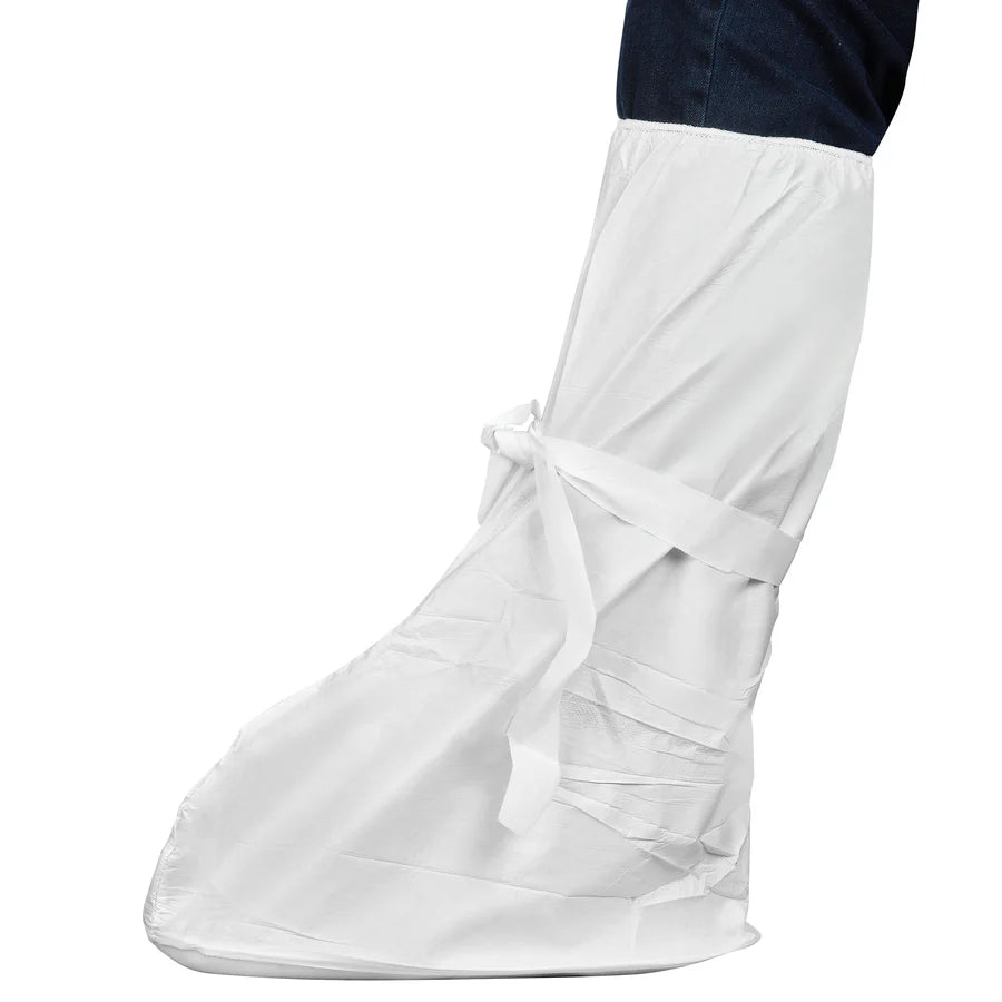 A disposable white overboot with tie closures, being worn over dark blue pants.