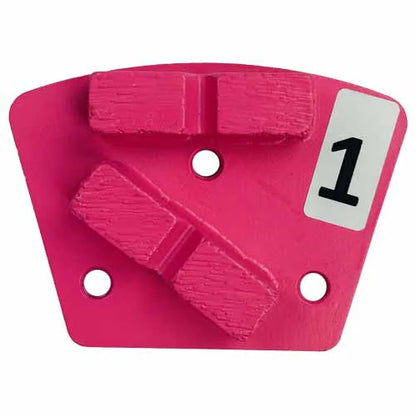 A pink, fan-shaped diamond grinding segment with two abrasive bars, mounting holes, and a label marked with the number "1."
