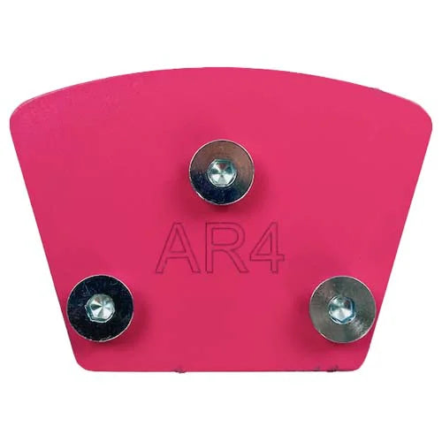 A pink, fan-shaped metal plate for a concrete floor grinder, engraved with "AR4" and featuring three installed mounting bolts. 