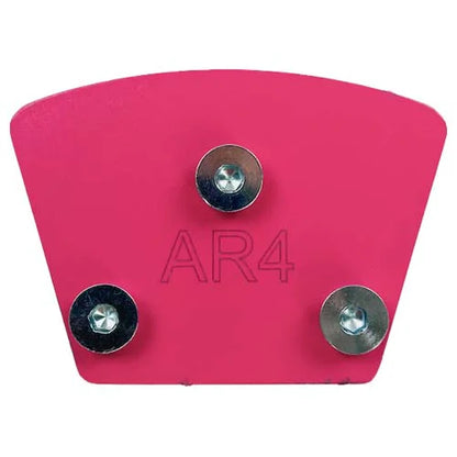 A pink, fan-shaped metal plate for a concrete floor grinder, engraved with "AR4" and featuring three installed mounting bolts. 