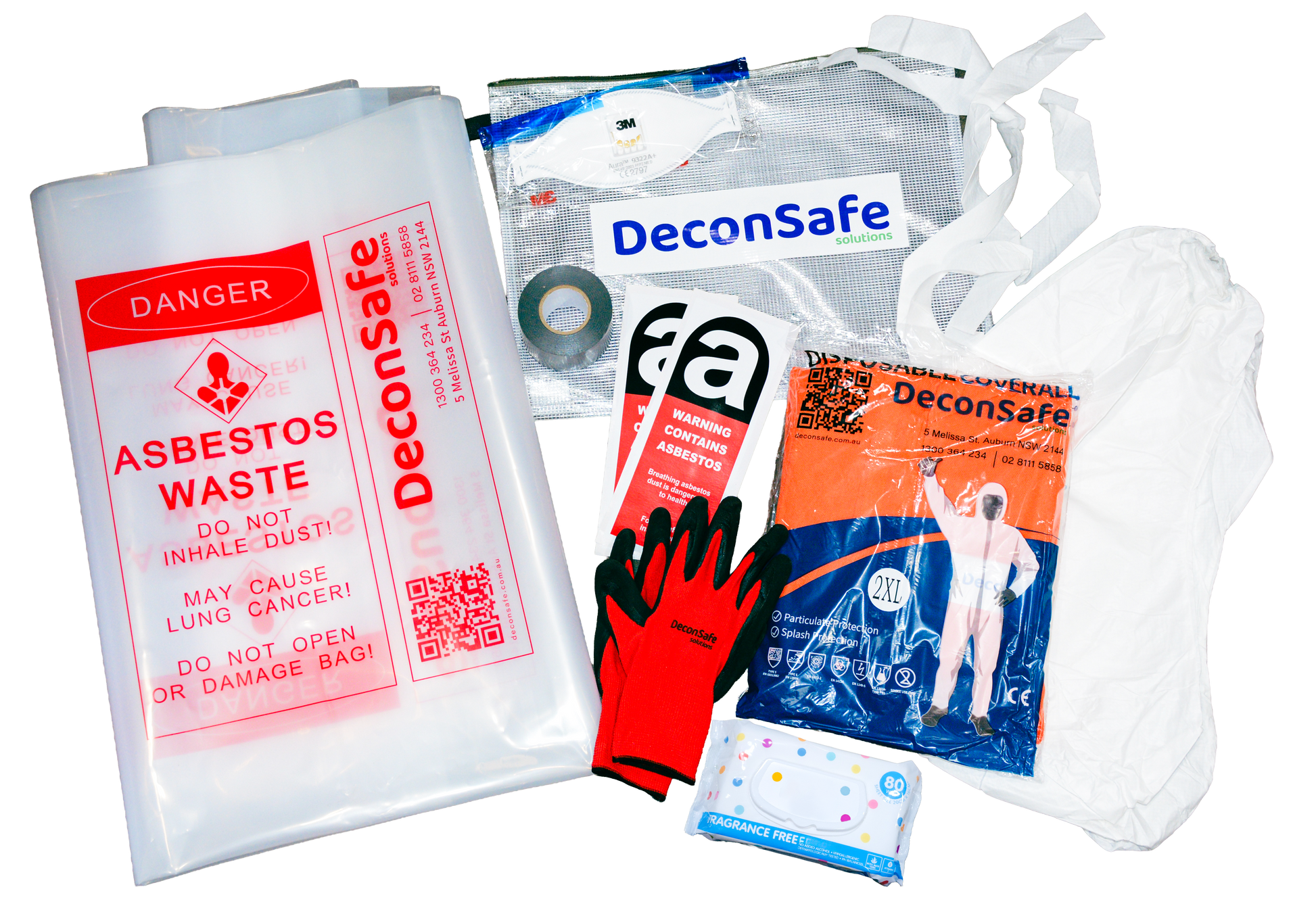 An overhead view of a DeconSafe asbestos safety kit with labeled waste bags, a respirator, and warning labels. It also includes protective gloves, a disposable coverall, a hood, duct tape, and wet wipes.