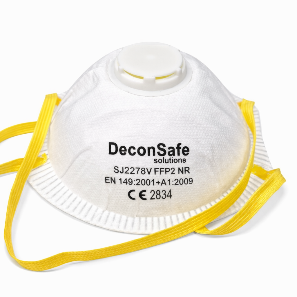 A white DeconSafe Solutions FFP2 cup-shaped dust mask with a top exhalation valve and yellow elastic straps, showing product technical specifications printed on the front against a plain white background.
