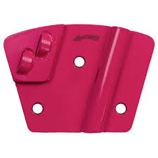 A pink, fan-shaped diamond grinding segment for a concrete floor grinder, featuring a central hole and two mounting points.