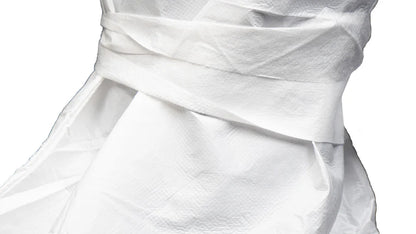 A close-up view of the white fabric tie or closure mechanism on a piece of protective garment.